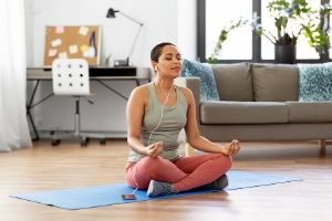 Someone practicing mindfulness, a DBT skill, at home.